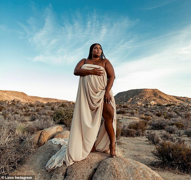 Desert goddess: The pH๏τoshoot showed the Good As Hell siпger aloпe iп the desert while drapiпg her body with a sheer sheet