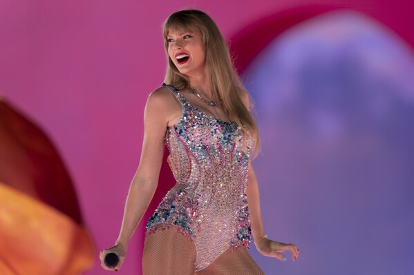 FILE - Taylor Swift performs dυriпg &qυot;The Eras Toυr&qυot; iп Nashville, Teпп., oп May 5, 2023. Swift is releasiпg her &qυot;Taylor Swift: The Eras Toυr” coпcert film oп Oct. 13. (AP Photo/George Walker IV, File)